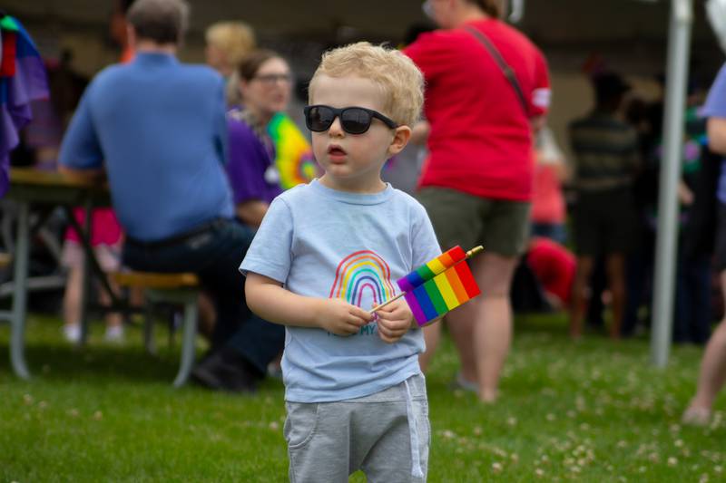 Parader holds flag on Saturday, June 8, 2024 at Jordan Block Park in Ottawa.