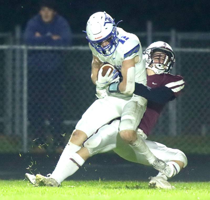 Vernon Hills’ Devin Ratajczyk is brought down by Prairie Ridge’s Landon Moffitt in IHSA football Class 5A first-round playoff action at Prairie Ridge High School in Crystal Lake on Friday, October 31, 2025.