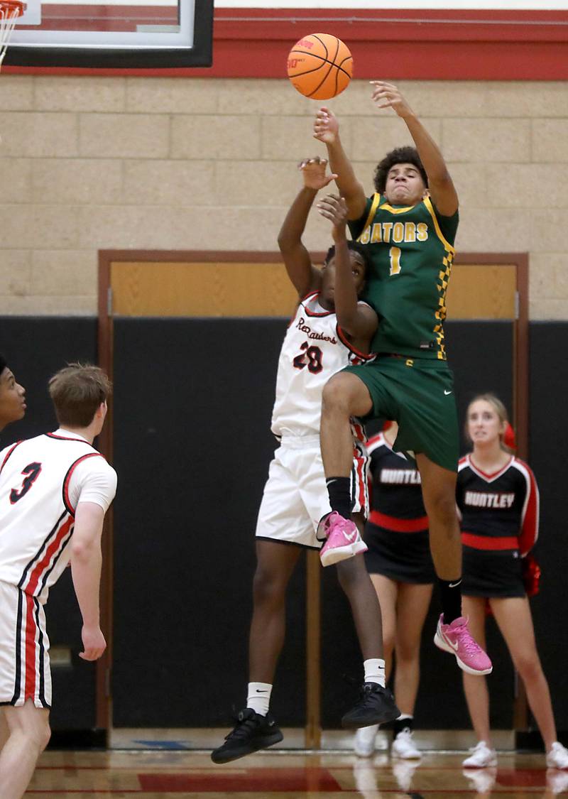 Huntley's Isaiah Onu battle with Crystal Lake South's Noah Cook for a rebound during a Fox Valley Conference boys basketball game on Wednesday, Dec. 10, 2025, at Huntley High School.