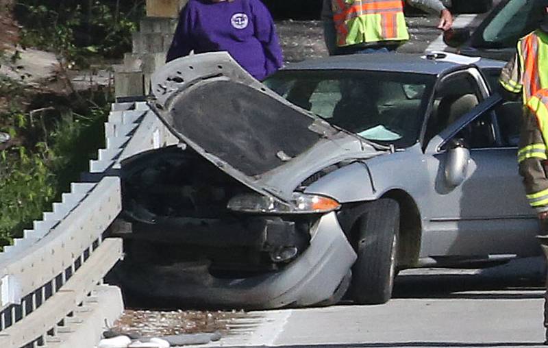 Tonica and Utica fire departments along with La Salle County Sheriff deputies, work the scene of a two-vehicle crash on the Illinois Route 178 bridge over the Vermilion River on Monday, April 22, 2024 near Lowell. The accident happened shortly before 8:30a.m. Both lanes of Illinois 178 were temporarily shut down while emergency crews assisted at the scene.