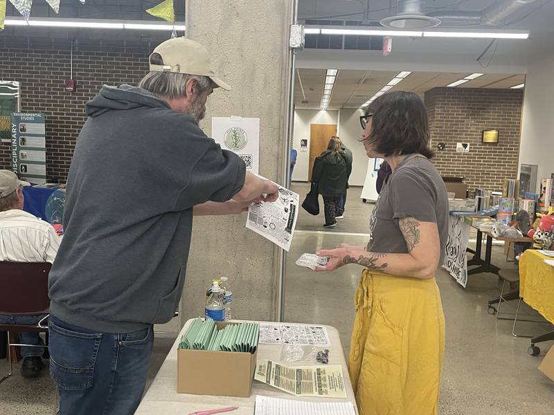 Austin Cliffe (left) shares some information with Marcy Prchal Saturday, April 11, 2026, during the third annual DeKalb County Earth Fest held at NIU's Founders Memorial Library in DeKalb.