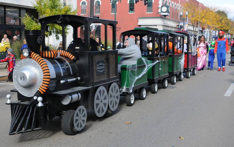 A train full of trick or treaters makes it’s way down La Salle St in Ottawa during it’s Halloween Parade Saturday.