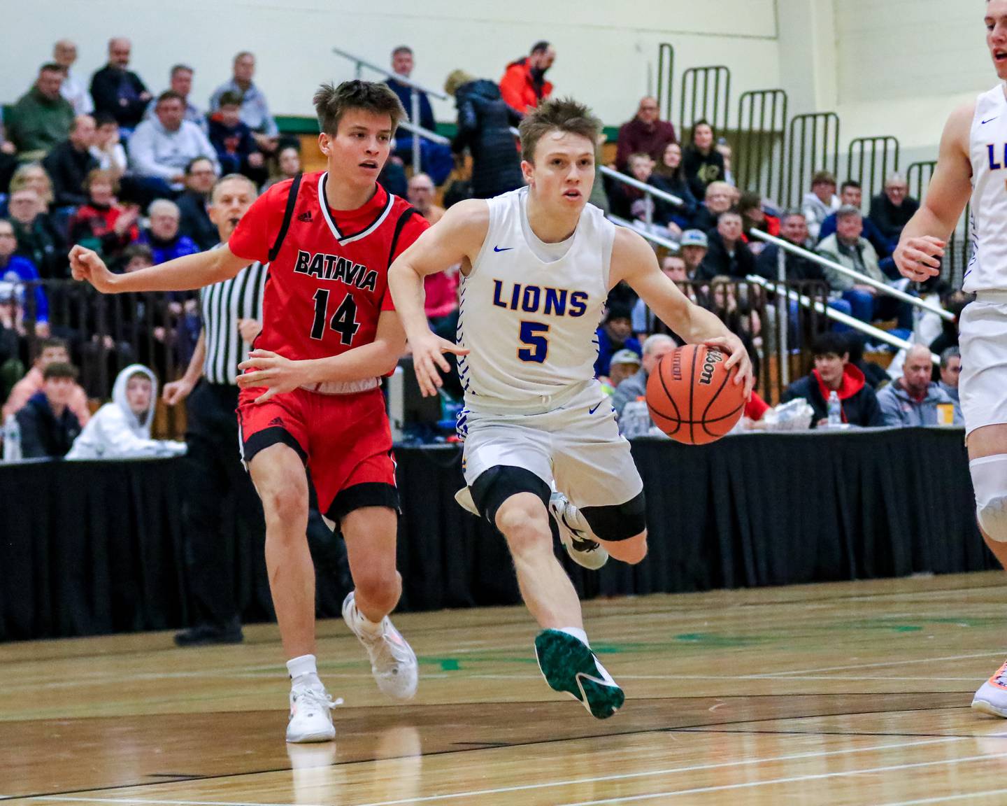 Lyons Jackson Niego (5) drives to the basket during their Jack Tosh Holiday Classic basketball game at Batavia. Dec 26, 2022.