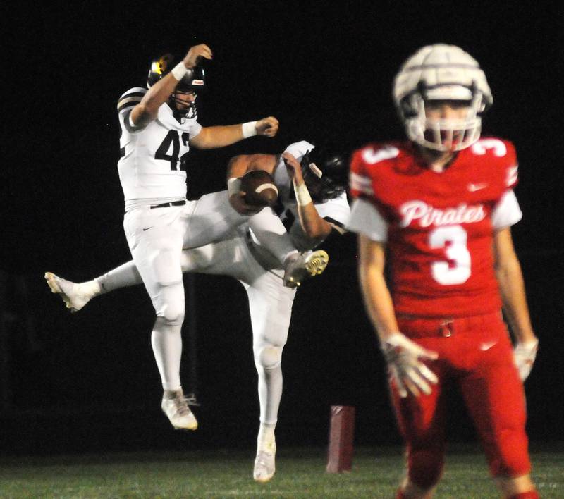 Sycamore teammates Andrew Nehring (42) and Cooper Bode celebrate Bode's touchdown as Ottawa's George Shumway (3) walks away on Friday, Sept. 26, 2025 at King Field.