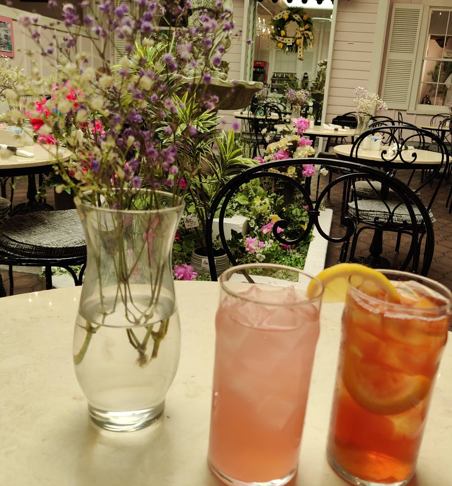 The Little Traveler, celebrating its centennial, is home to The Atrium Café in downtown Geneva.