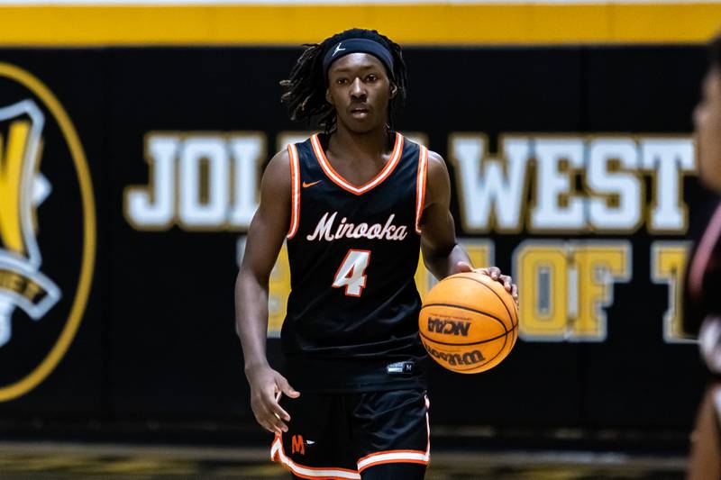 Minooka's Nehemiah Brown goes on offense during a varsity boys basketball game against Joliet West at Joliet West on Jan. 6, 2026.