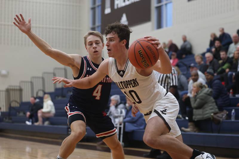 Joliet Catholic’s TY Schlageter drives to the baseline against St. Viator.