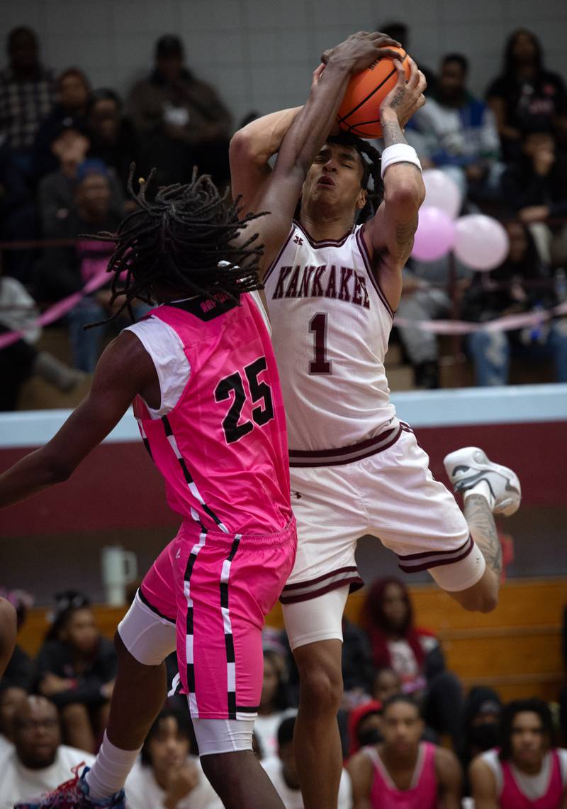 Kankakee's Lincoln Williams is blocked by Rich Township's Dyron Watson in a game on Friday, February 6, 2026.
