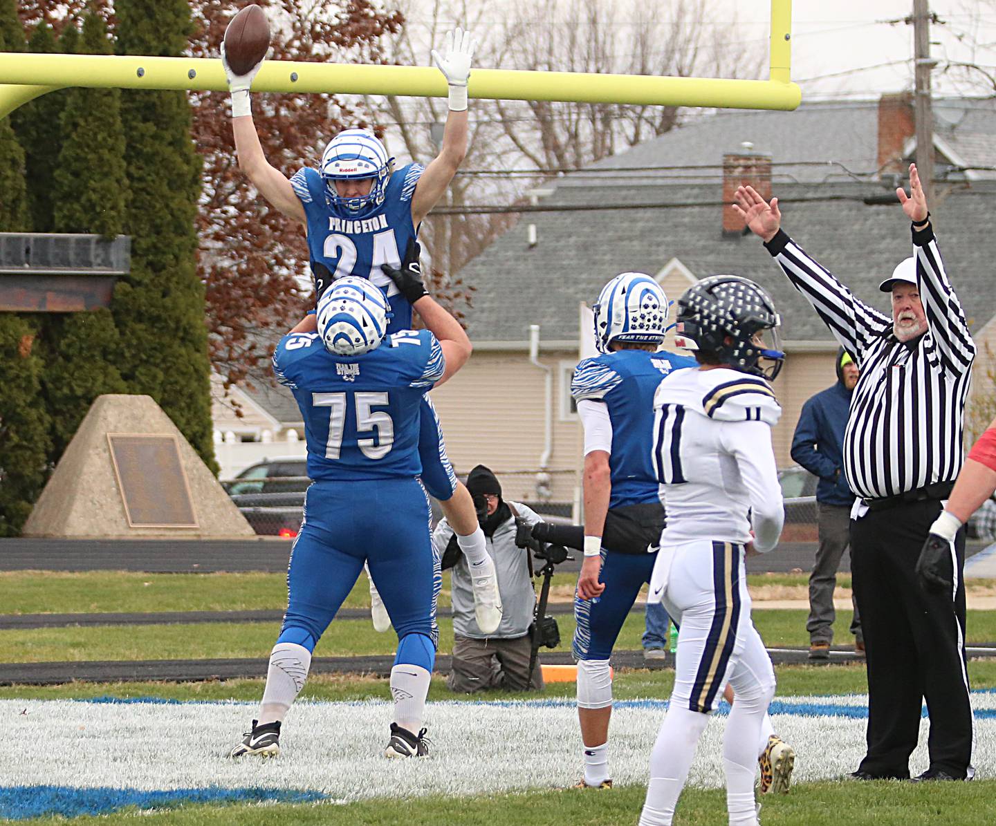 Princeton's Danny Cihocki (24) celebrates scoring a touchdown with teammate Payne Miller (75) in the Class 3A Quarterfinal game on Saturday, Nov. 12, 2022 in Princeton.