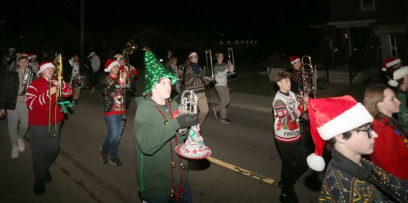 La Salle-Peru Township High School marching band plays Christmas music during the annual Christmas Parade on Saturday, Dec. 7, 2024 on Peoria Street in Peru.