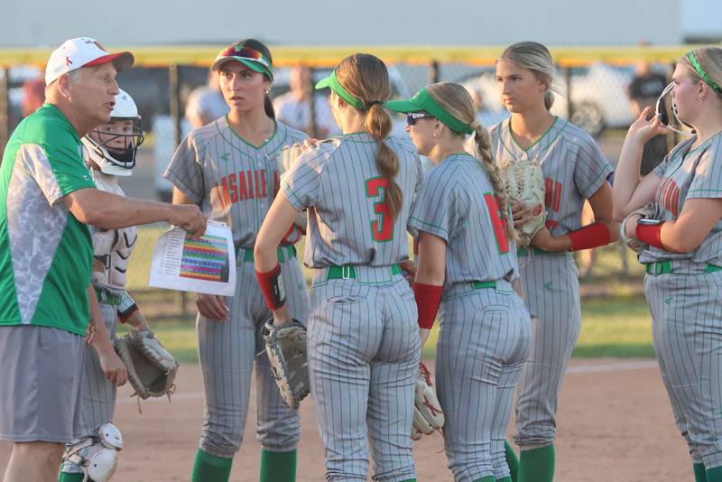 L-P head softball coach Randy Huebbe talks to his team while playing Dunlap during the Class 3A Sectional semifinal game on Tuesday, May 26, 2026 at the L-P Athletic Complex in La Salle.
