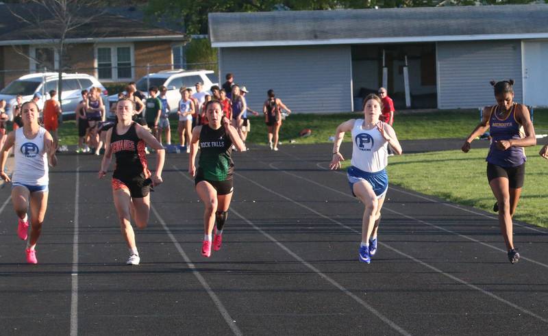 (From left) Princeton's Scarlet Fulton, Kewanee's Danielle Jo Currier, Princeton's Camryn Driscoll, and Mendota's Mariyah Elam compete in the 100 meter dash during the Ferris Invitational on Monday, April 15, 2024 at Princeton High School.