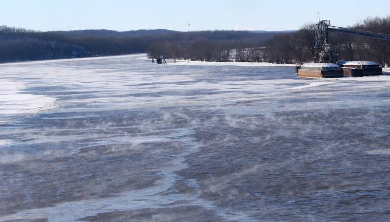 Steam rises from the Illinois River on Tuesday, Jan. 16, 2024, near Utica.