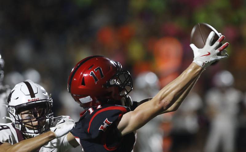 Huntley's Jacob Marx catches touchdown pass in front of Prairie Ridge's Alexander Trejo during a Fox Valley Conference football game on Friday, Oct. 3, 2025, at Huntley High School.
