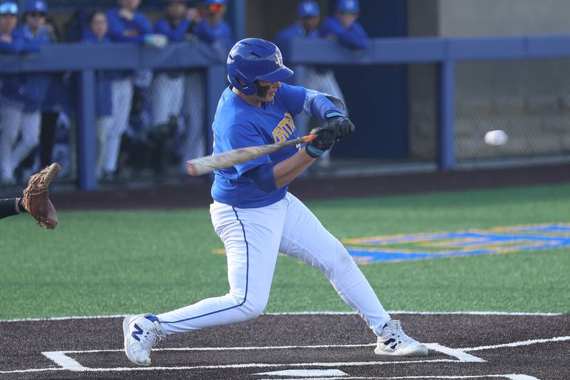 Joliet Central’s Gilberto Garcia connects against Minooka  on Monday, April 6, 2026 in Joliet.