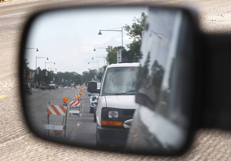 Traffic navigates roads construction on Illinois Route 14 near the intersection with Dole Avenue in Crystal Lake on Tuesday, Aug. 23, 2022. A lot of road construction programs in McHenry County cities are wrapping up, but some road projects, though will see work into the fall.