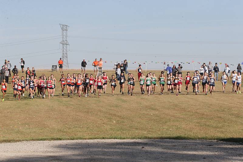 Cross Country girls begin the Class 1A Regional Cross Country race on Saturday, Oct. 22, 2022 at the Seneca FFA Farm in Marseilles.