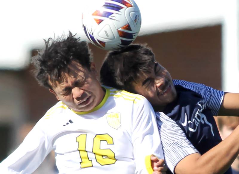 Harvard’s Kevin Contreras, left, battles Cary-Grove’s Gerardo Garcia in IHSA Class 2A Regional Title Game soccer action on Saturday, Oct. 26, 2024, at  Harvard Junior High School  in Harvard.