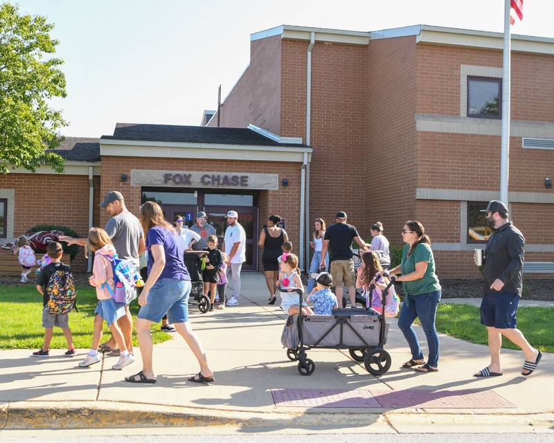 Students get dropped off at Fox Chase elementary school in Oswego during the first day of the school year on Wednesday Aug. 16, 2023.