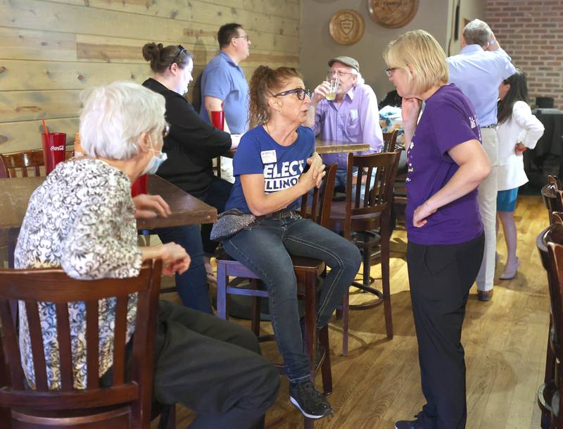 Candidates and supporters wait for election results Tuesday, June 28, 2022, during a Democrat candidate watch party at Fatty's Pub and Grille in DeKalb.