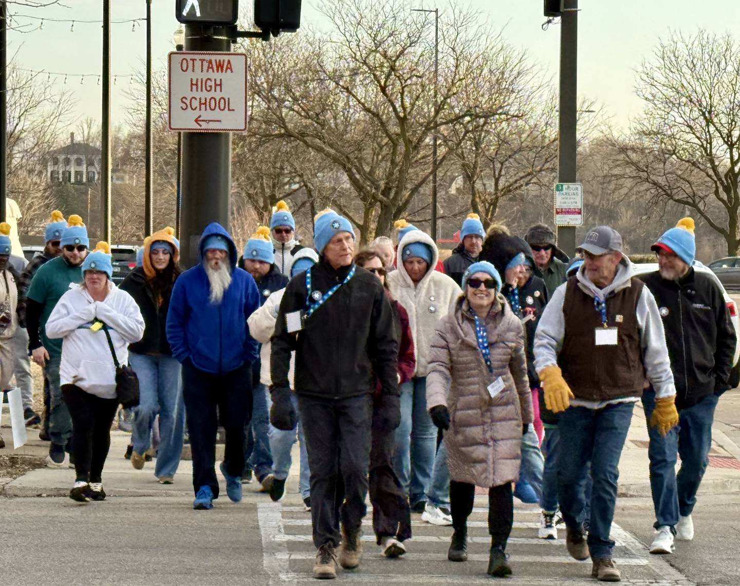 Participants bundle up against the cold as they make their way through downtown Ottawa during the "Coldest Night of the Year" walk at Jordan Block Park on Saturday. The event brought together walkers from across the community to support a local cause.