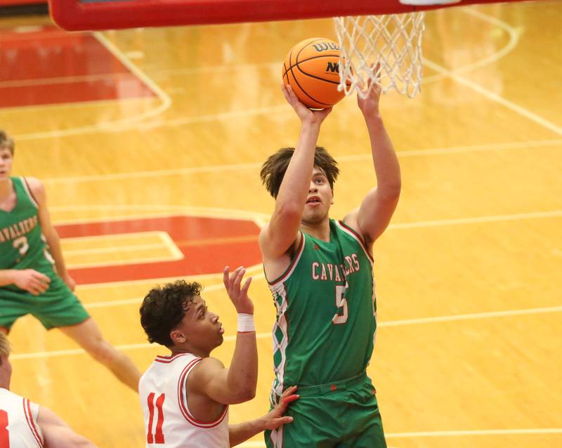 L-P's Erick Sotelo shoots a jump shot over Ottawa's Hezekiah Joachim on Friday, Feb. 6, 2026 in Kingman Gymnasium at Ottawa High School.