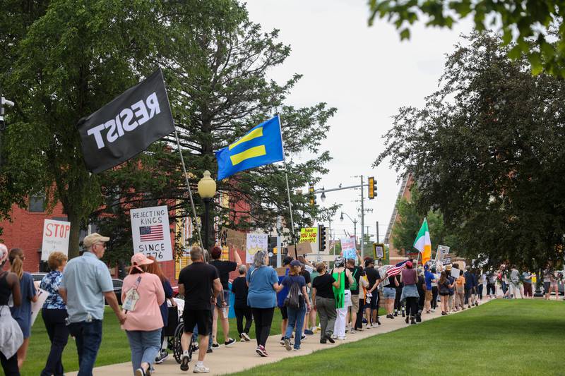 Approximately 500 protesters march the sidewalks at the Kankakee County Courthouse for a ‘No Kings’ rally in Kankakee on Saturday, June 14, 2025, to protest actions by President Donald Trump.