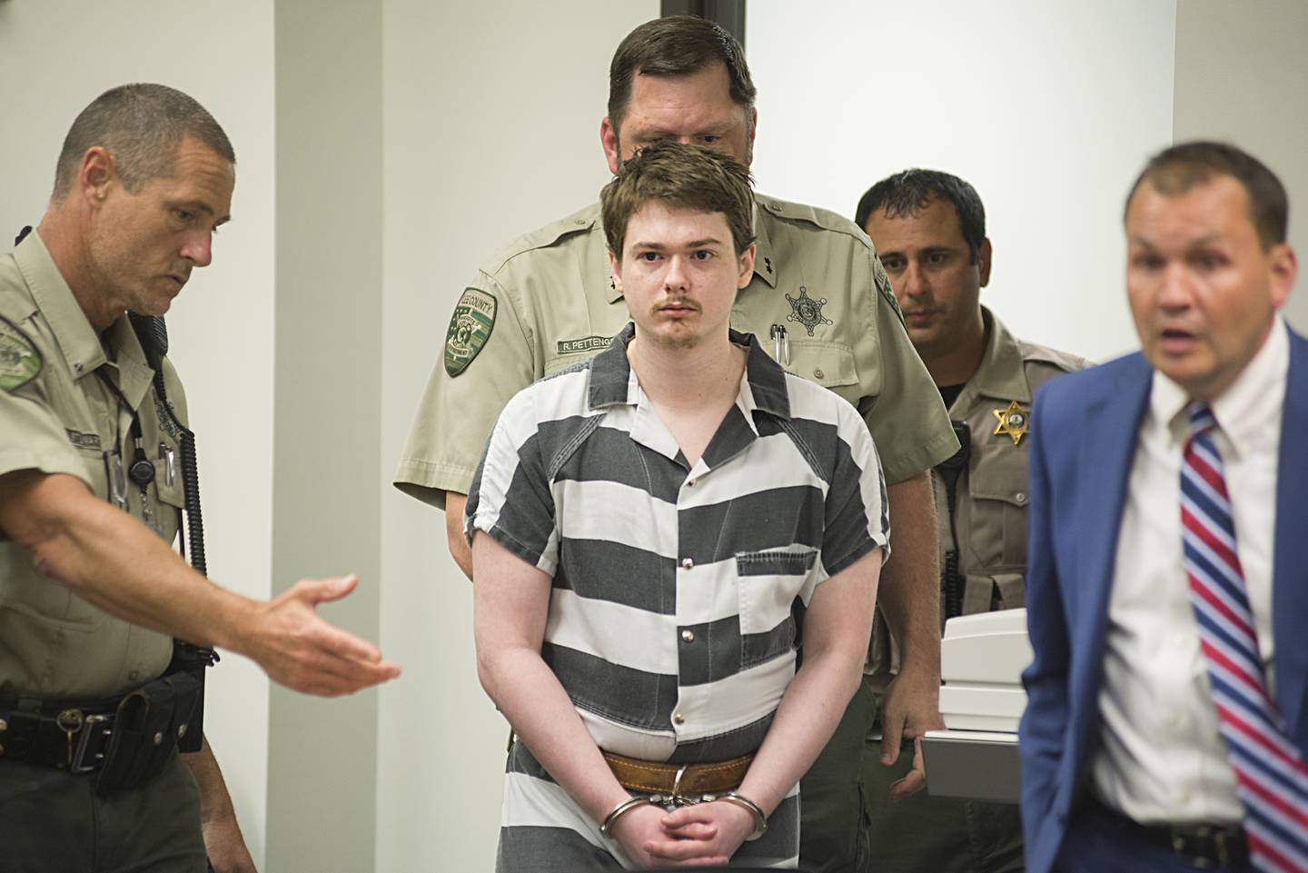 Dixon High School shooter Matthew Milby enters a Lee County courtroom Thursday, July 14, 2022. Milby pled guilty to two Class X felonies.