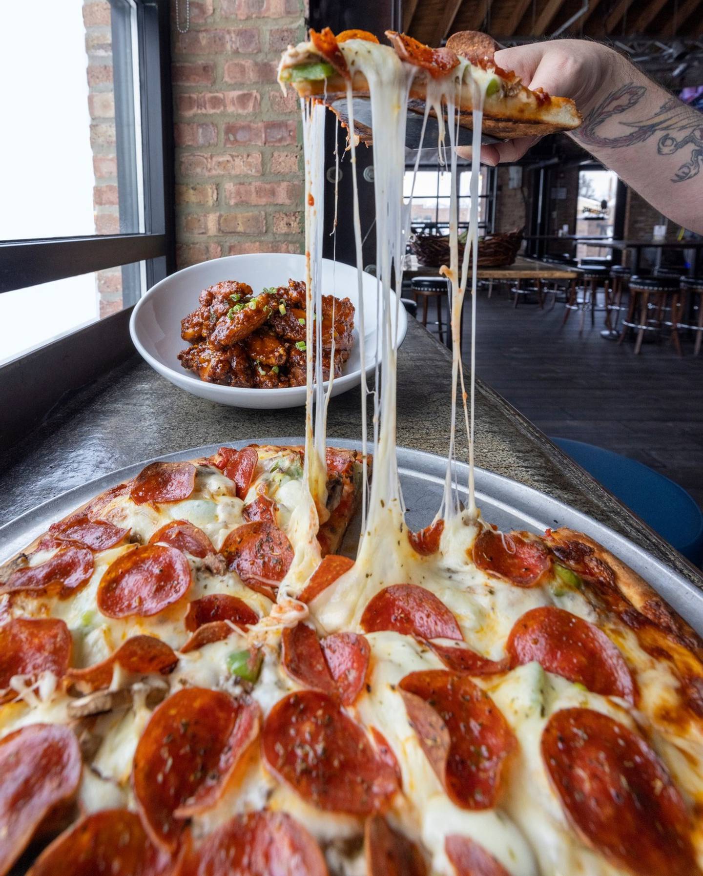 Paisans Pizzeria & Bar in Berwyn was named one of the finest pizza places in the Cook County as as picked by our readers in 2021. (Photo from Paisans Pizzeria & Bar Facebook page)