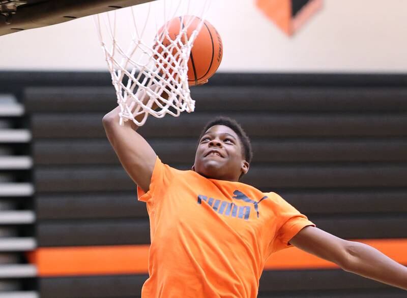 DeKalb’s Davon Grant goes up for a dunk during practice Monday, June 19, 2023, at DeKalb High School.