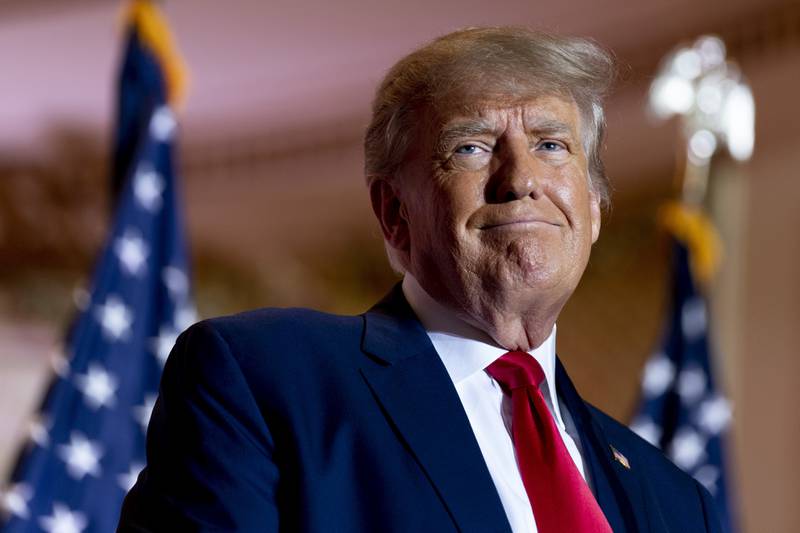 FILE - Former President Donald Trump announces he is running for president for the third time as he smiles while speaking at Mar-a-Lago in Palm Beach, Fla., Nov. 15, 2022. A Florida Judge sanctioned Trump and one of his attorneys Thursday, Jan. 19, ordering them to pay nearly $1 million for filing what he said was a bogus lawsuit against Trump's 2016 rival Hillary Clinton and others. (AP Photo/Andrew Harnik, File)