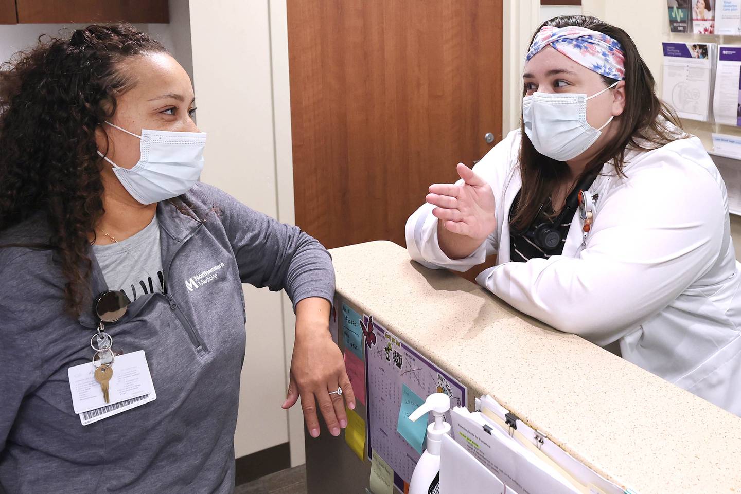 Pediatrician Dr. Blair Wright (right) talks to Alexis Wooden, a medical assistant, Friday, Nov. 4, 2022, at Northwestern Medicine Valley West Hospital in Sandwich.