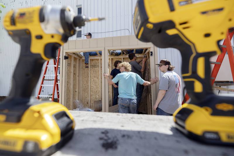 Ag Construction members get to work building the frame of the food center Friday, May 16, 2025.