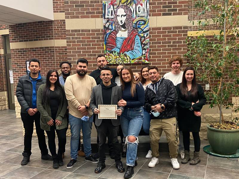 Francisco "Frankie" Contreras with family and friends after being recognized at Village Hall.