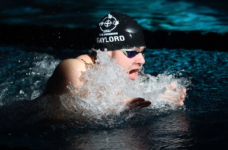 Mason Gaylord of Cary-Grove co-op swims the 100-Yard Breaststroke during the Fox Valley Conference Swimming Championships at Woodstock North High School Saturday.