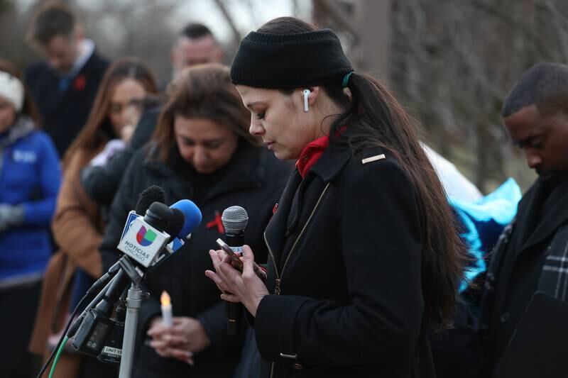 Teresa Martin, who helped organize the evening, leads a moment of silence at the candlelight vigil for the victims of the March 5th shooting on Wednesday, March 8th, 2023 in Bolingbrook.