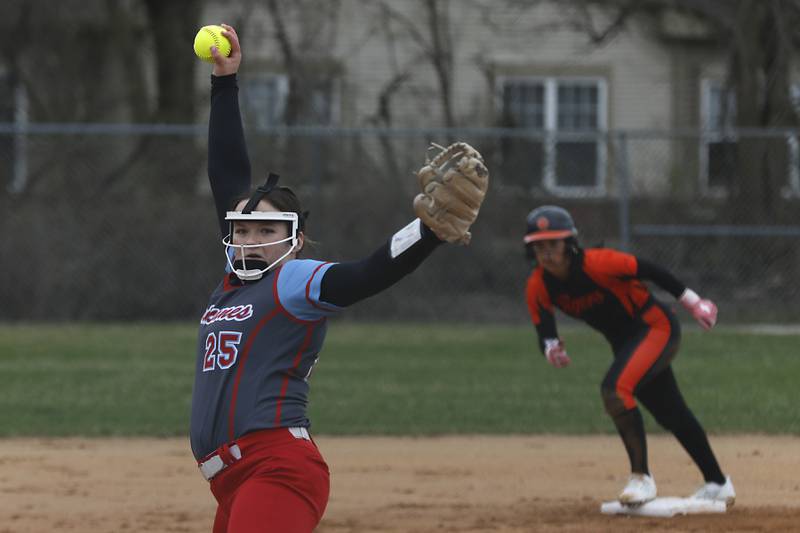 Marian Central's Christine Chmiel throws a pitch as Crystal Lake Central's Ella Arana looks to run during a nonconference softball game on Thursday, April 3, 2025, at Bates Park in Woodstock.
