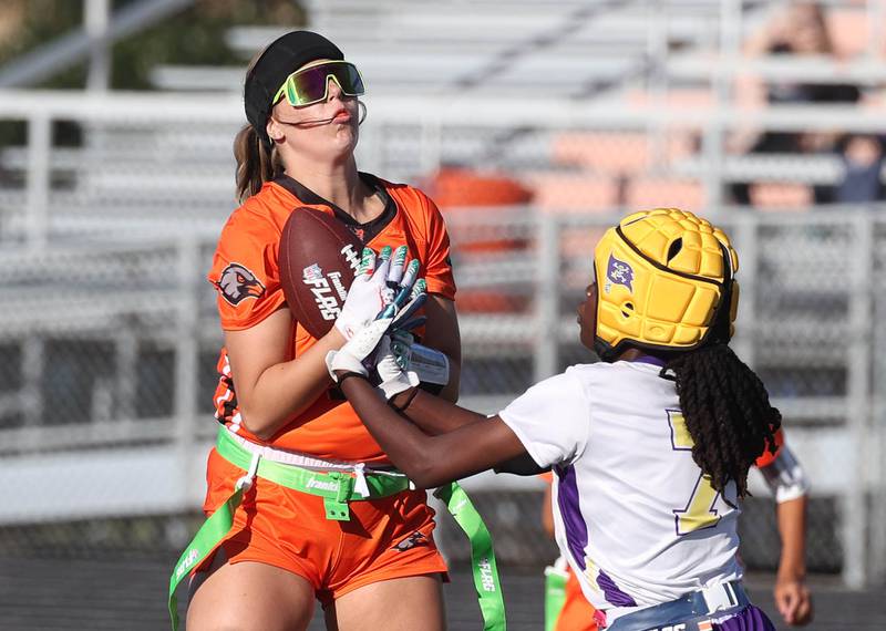 DeKalb's Elora Slater makes her second interception Monday, Aug. 25, 2025, during their game against Belvidere at DeKalb High School. The contest marked the first ever game for the girls flag football program at DeKalb.