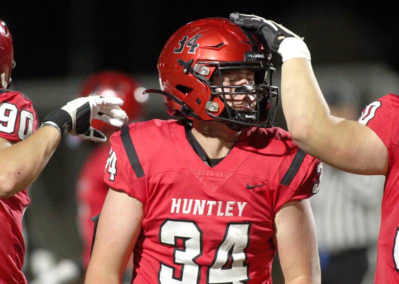 Huntley’s Haiden Janke celebrates a touchdown against Niles West in first-round Class 8A playoff football action at Huntley Friday.