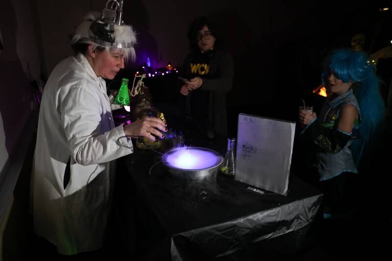 Kids walk through the Haunted Lab at the STEAM Spooktacular hosted by the After the Peanut Foundation on Wednesday at Lewis University.