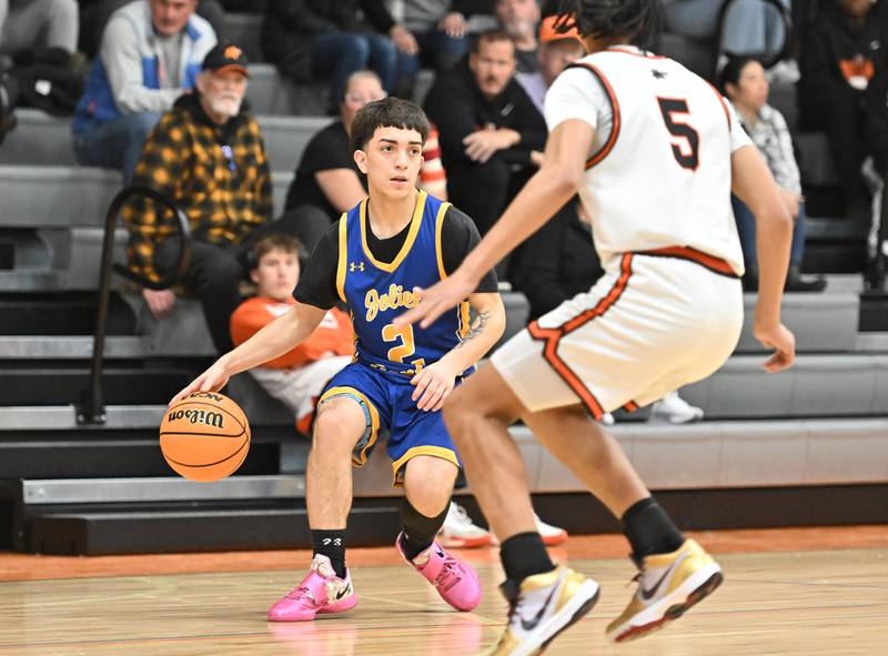 Joliet Central's Jayden Poplawski (2) in action during a conference game against Minooka on Friday, Jan. 10, 2025, at Minooka.