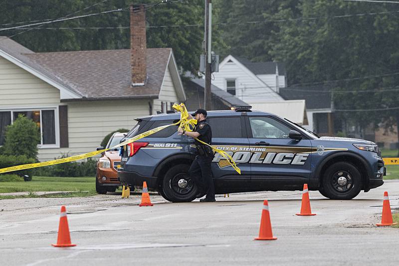 Officers rope off an area of East Fifth Street in Sterling on Tuesday, July 23, 2024, after a shooting.