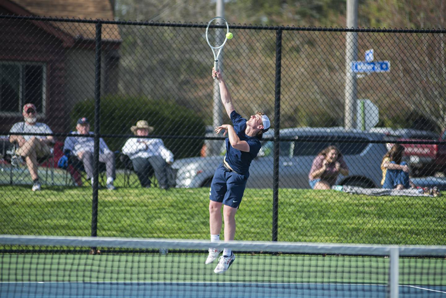Sterling’s Ben Boze serves against Newman’s Griffin Moran and James Rhodes Monday, May 9, 2022. Boze was playing with doubles partner Kayden Loos.
