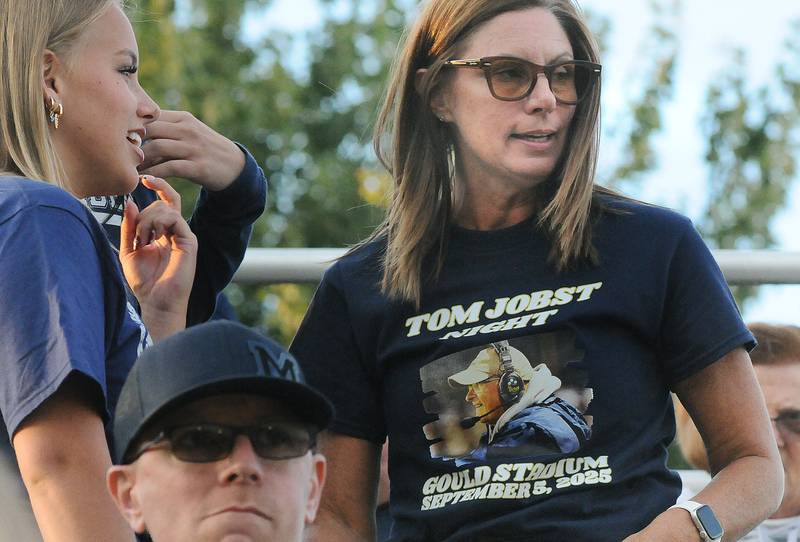 Many Crusader fans wore t-shirts honoring former Head Coach Tom Jobst who was honored at halftime during Friday’s game against Madison at Marquette.