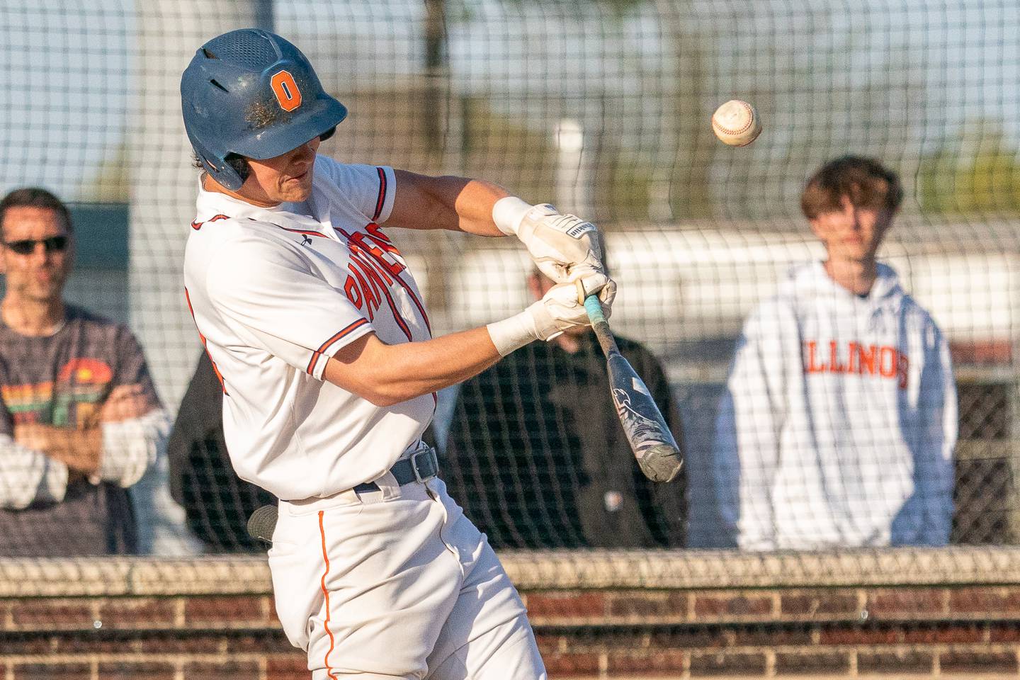 Oswego’s Trey Hernandez (14) hits a deep fly-ball against Minooka during a baseball game at Oswego High School on Tuesday, April 18, 2023.