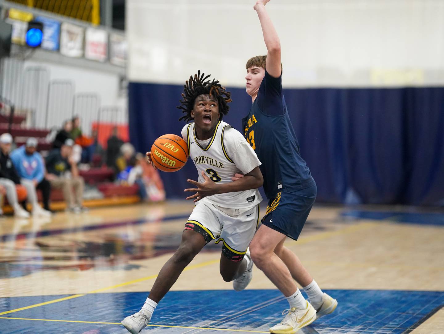 Yorkville Christian's Jayden Riley (3) drives to the basket against Neuqua Valley's Cole Kelly (23) during a basketball game at Yorkville Christian High School on Tuesday, February 4, 2025.