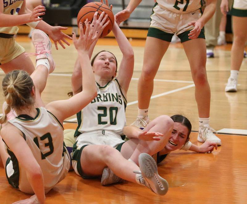 St. Bede's Lili McClain grabs a loose ball in the lane as Serena's Makayla McNally (right) arrives late to the play during the Class 1A Sectional final game on Thursday, Feb. 22, 2024 at Gardner-South Wilmington High School.