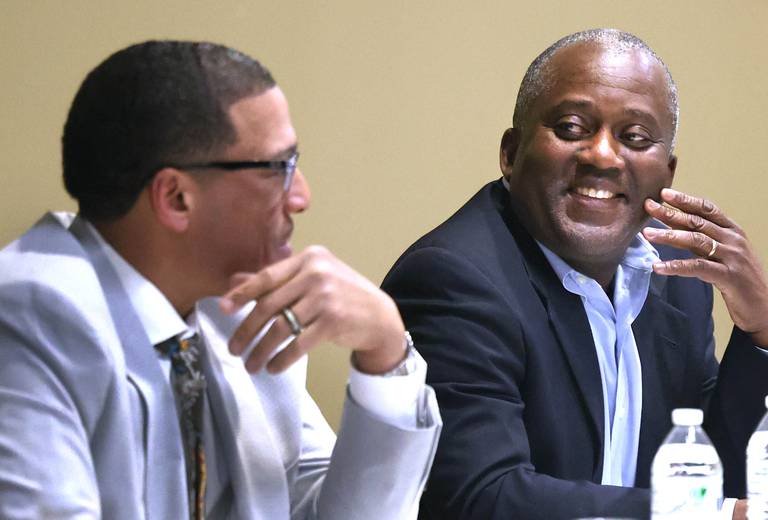 John Walker, (left) current DeKalb 7th Ward Alderman and candidate for mayor, talks to one of his opponents in the race for mayor Kouame Sanan Wednesday, Feb. 19, 2025, as they prepare for the start of the DeKalb Area Rental Association and DeKalb Area Builders Association Candidate Night at Faranda's Banquet Center in DeKalb. Others vying for the position of DeKalb mayor are current mayor Cohen Barnes and Linh Nguyen.