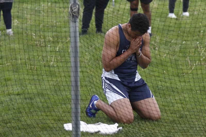 Cary-Grove’s Reece Ihenacho prays before throw the discus during the Fox Valley Conference Boys Track and Field Meet on Thursday, May 9, 2024, at Huntley High School.