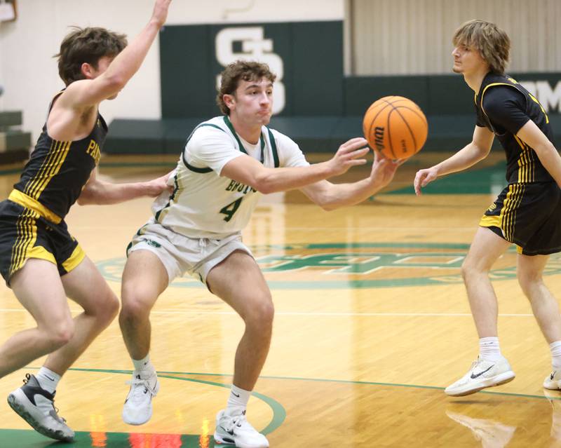 St. Bede's Gino Ferrari passes the ball away from Putnam County's Johnathon Stunkel during the Class 1A Regional quarterfinal game on Monday, Feb. 23, 2026 at St. Bede Academy.